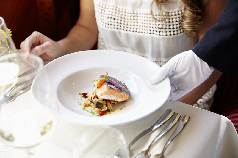 A course being served at the table aboard El Transcantábrico